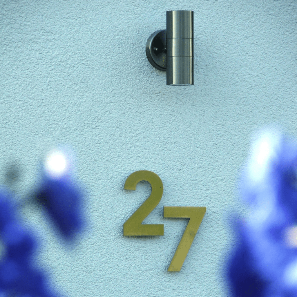 Exterior of a residential property with house number